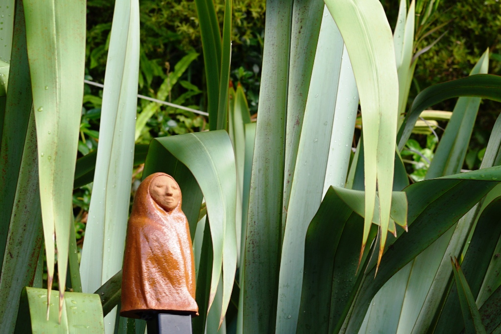 AllFlax by Wendy Naepflin - clay figure with flax AllFlax by Wendy Naepflin - clay figure with flax